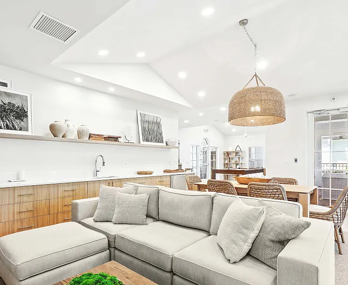 Chic open-concept living space with modern decor, cozy seating area, elegant dining set, and abundant natural light.