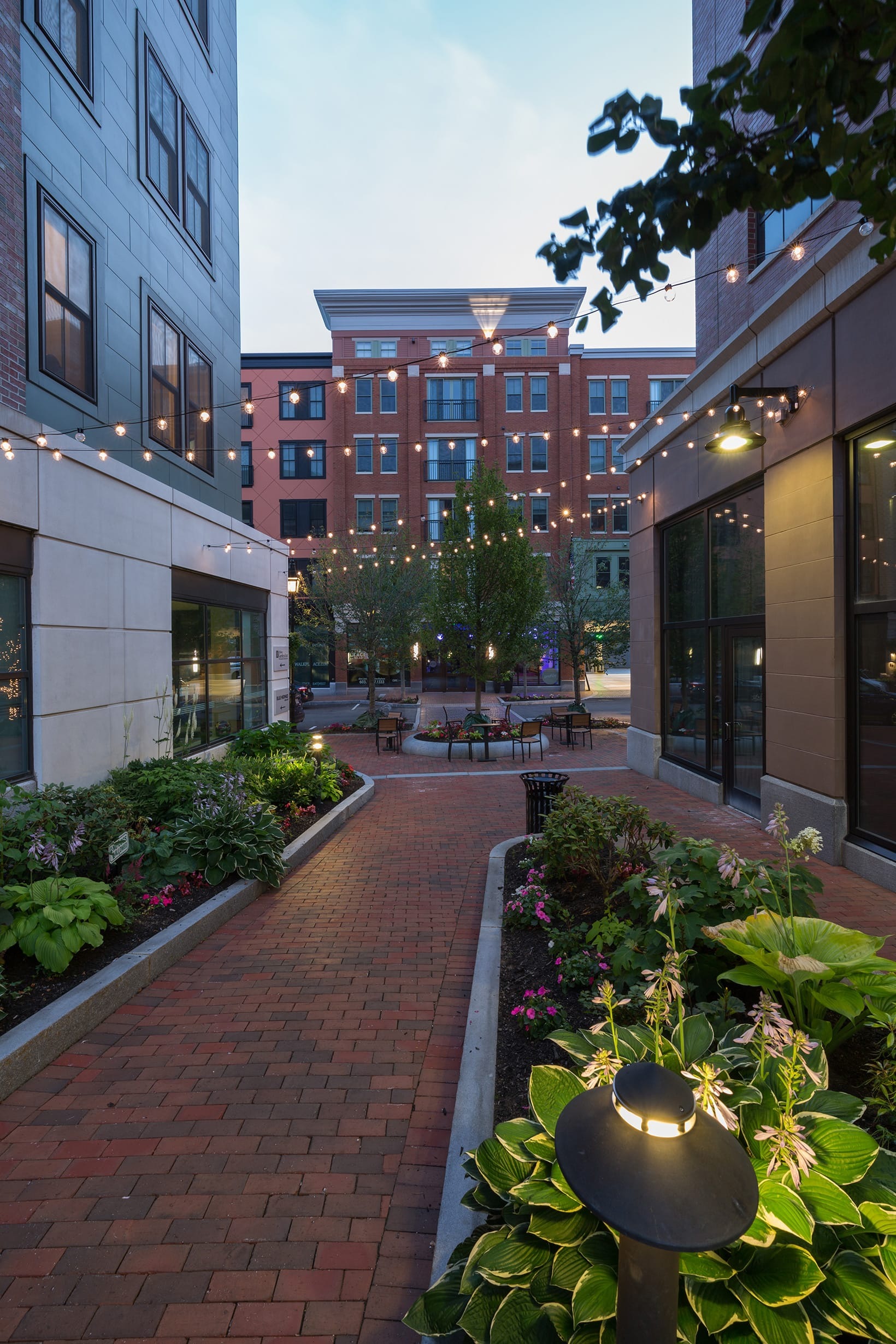 walkways with brick floors and modern lighting