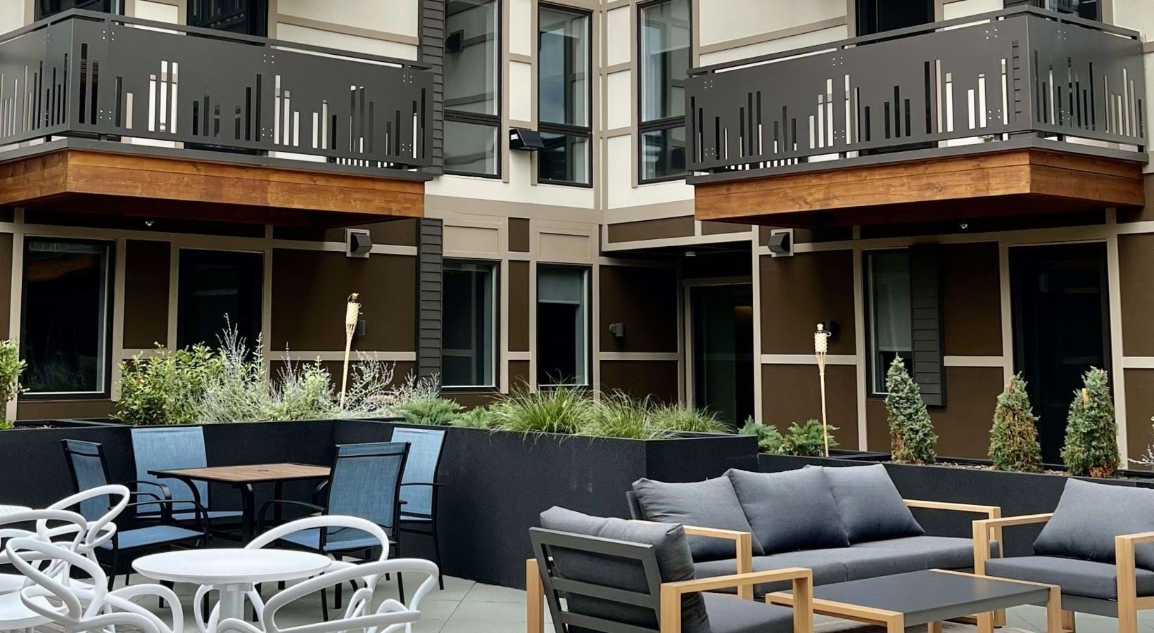 a courtyard with tables and chairs