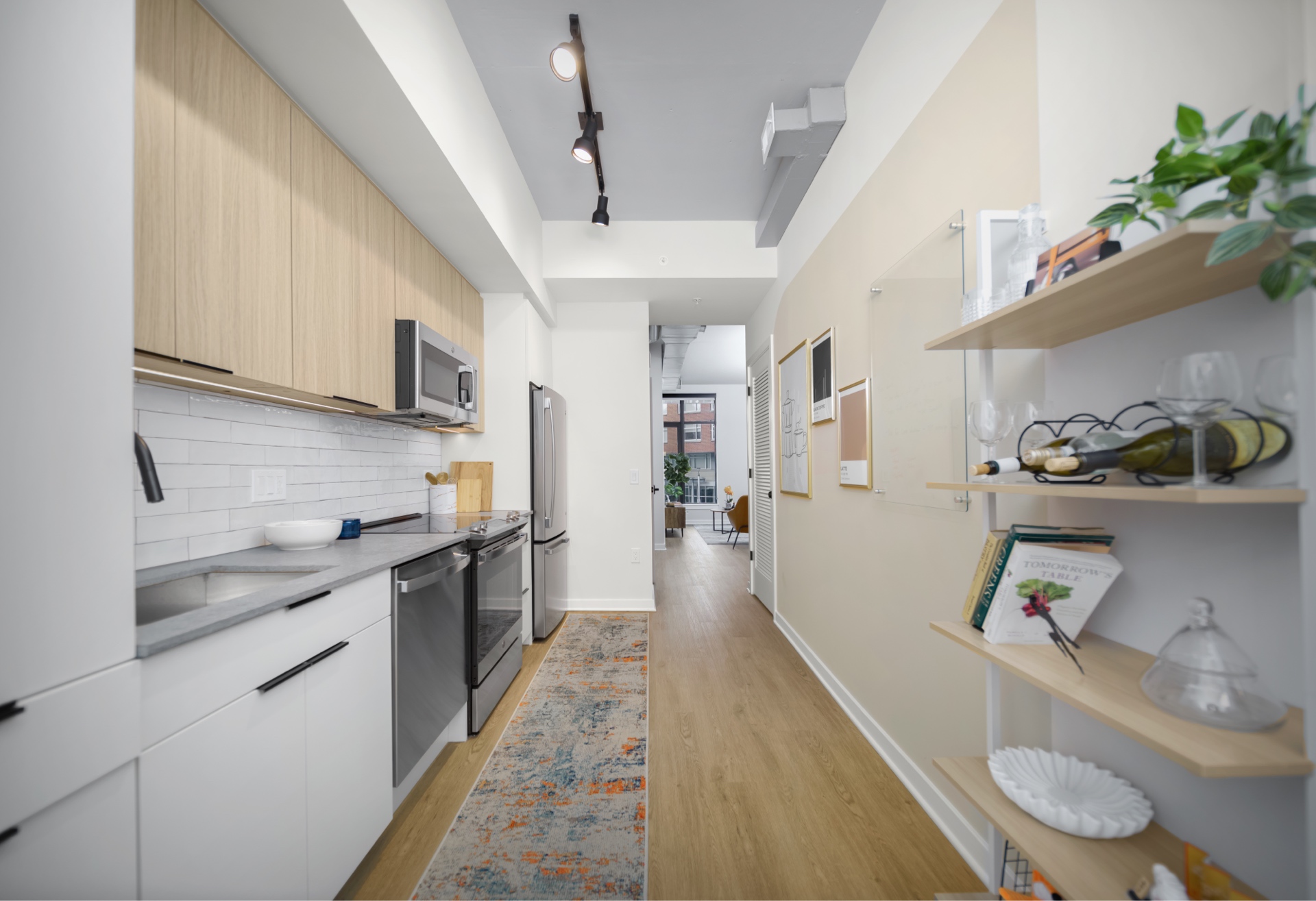 Modern kitchen in an apartment at The 202 in DC, featuring sleek cabinetry, stainless steel appliances, and a stylish layout.