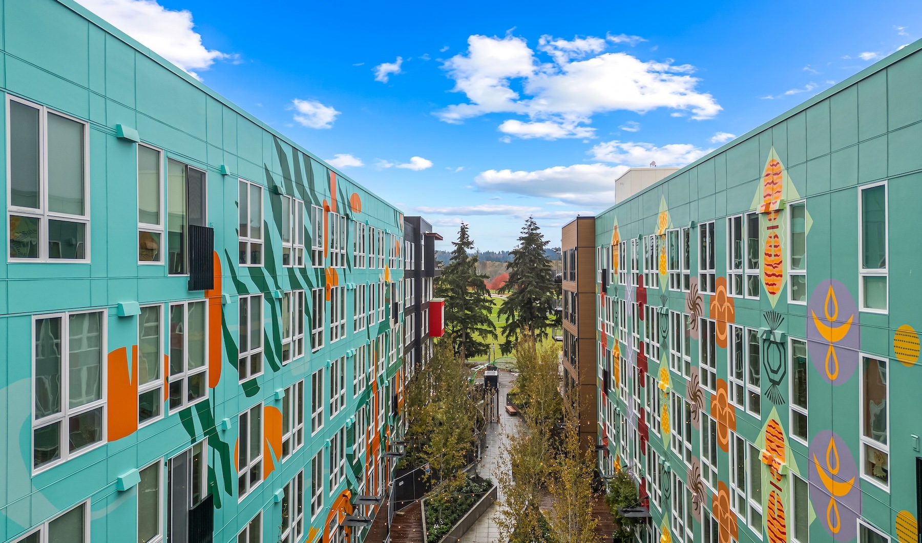 two buildings with trees in the middle