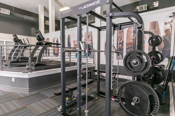 a gym with weights and cardio equipment in a building at Deerfield Village, Alpharetta, Georgia