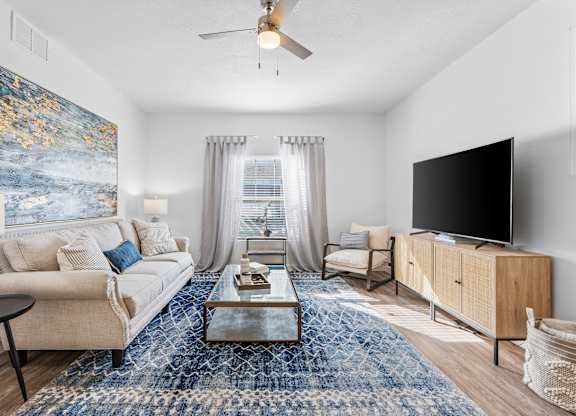 a living room with a couch and a tvat The View on 20th, Ogden, Utah