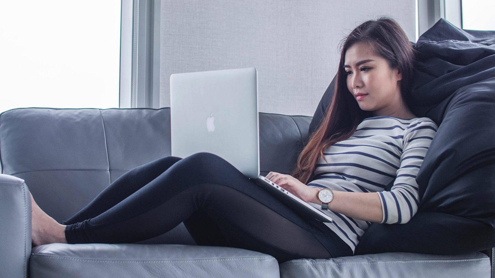 A girl works comfortably in her own private space.