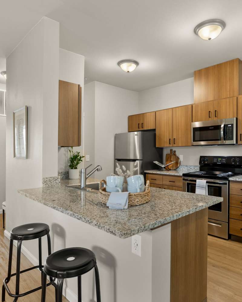 Kitchen with Island Table and chairs at Shaff Square Apartments in Stayton, Oregon