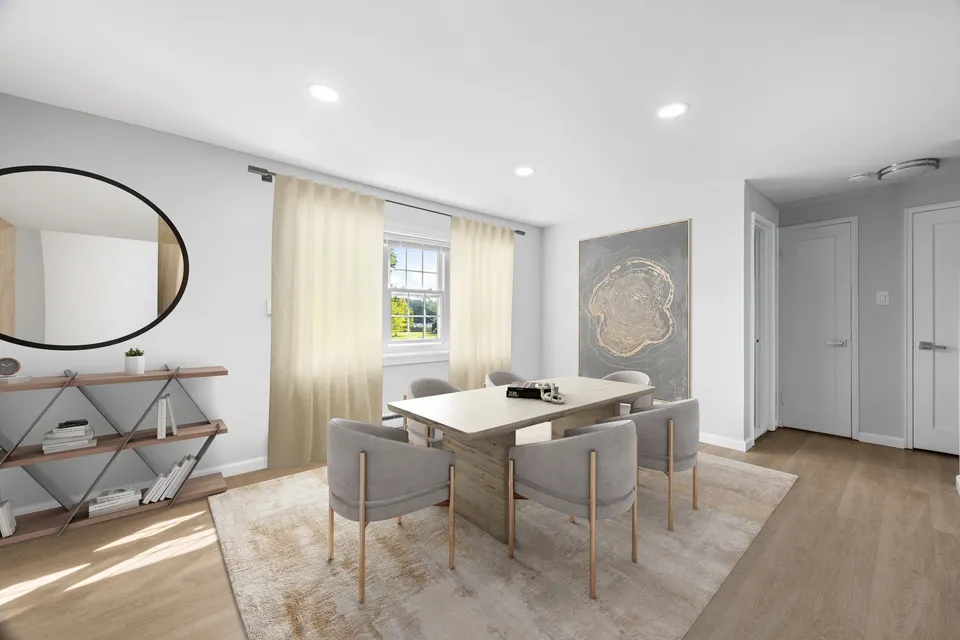 Chic dining room with elegant decor, stylish gray chairs, and a large window for natural light.