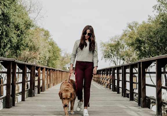 A woman walking with dog at Great Northern, Missoula, MT, 59808
