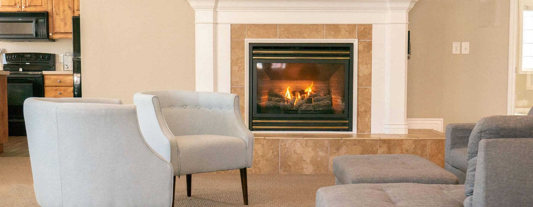 a club room with a fireplace