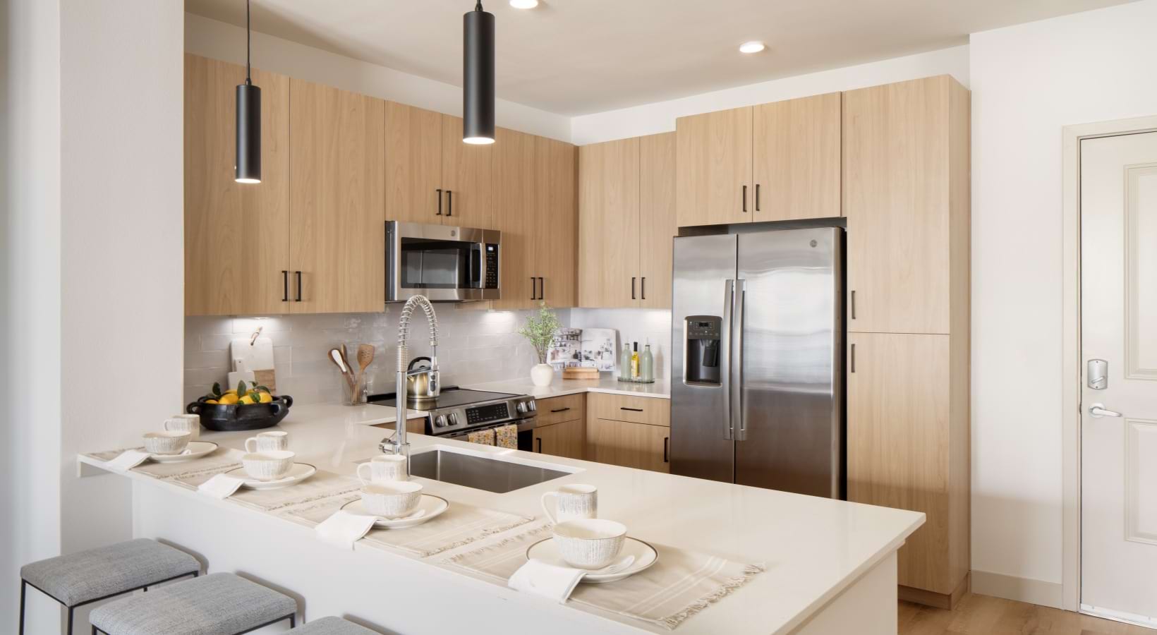 kitchen with white counter and bar stools