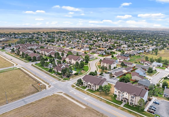A suburban neighborhood with houses and roads.