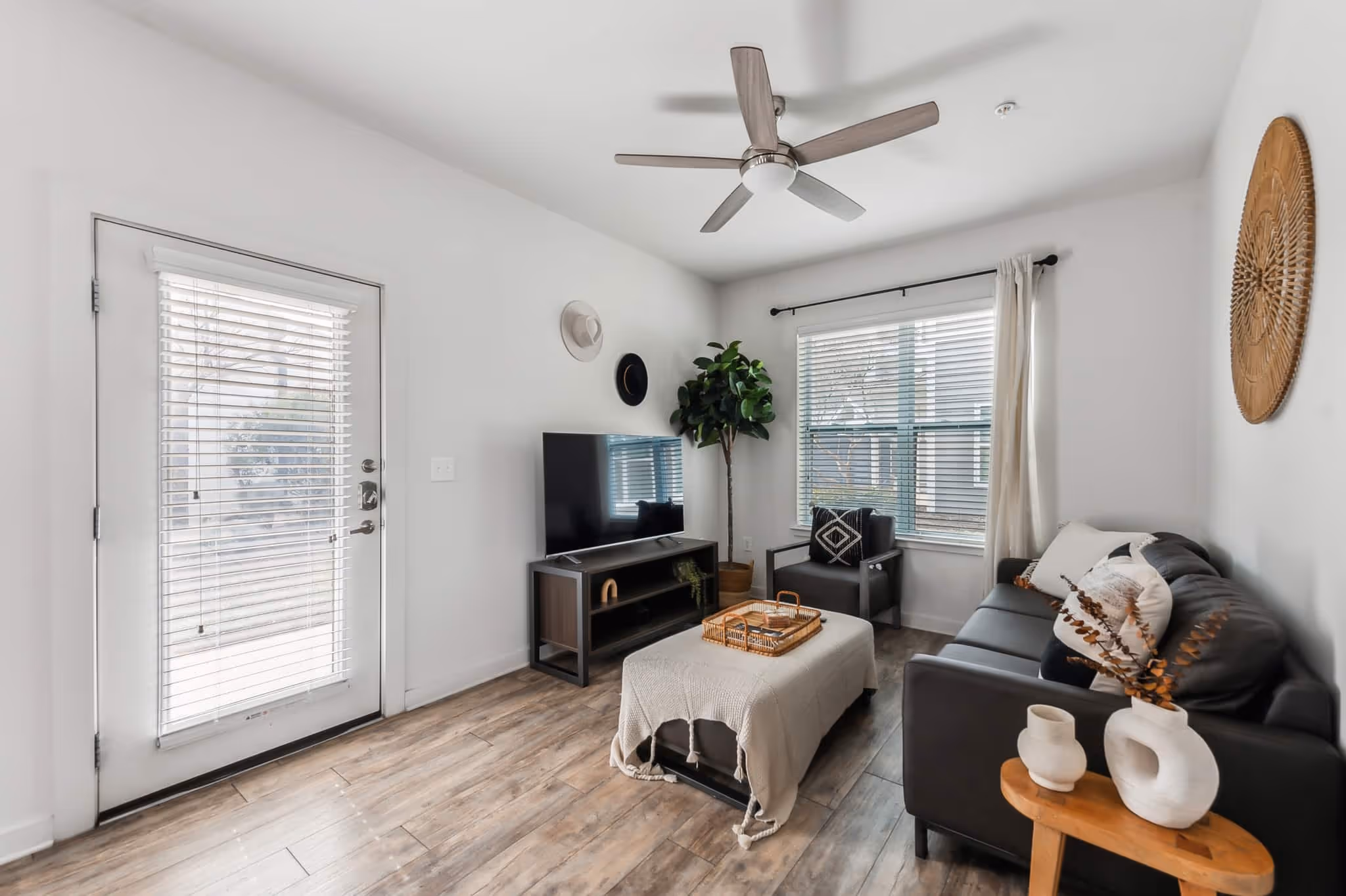 View of living area with furniture and tv