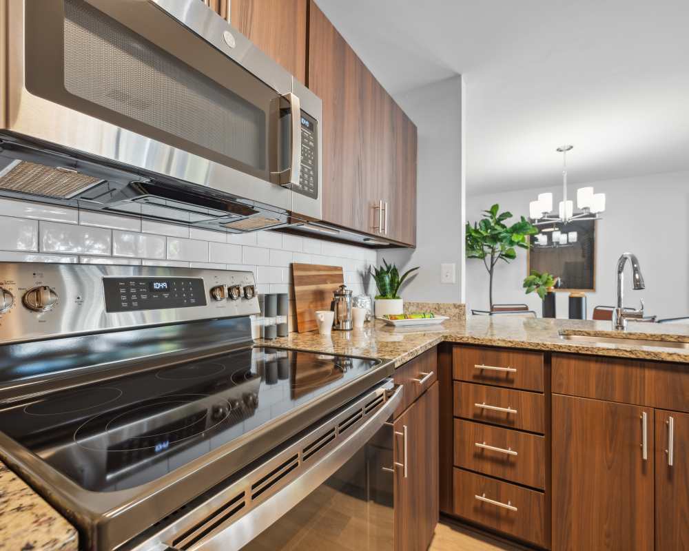 Kitchen with stainless steel appliances at Knoll at Fair Oaks in Fairfax, Virginia