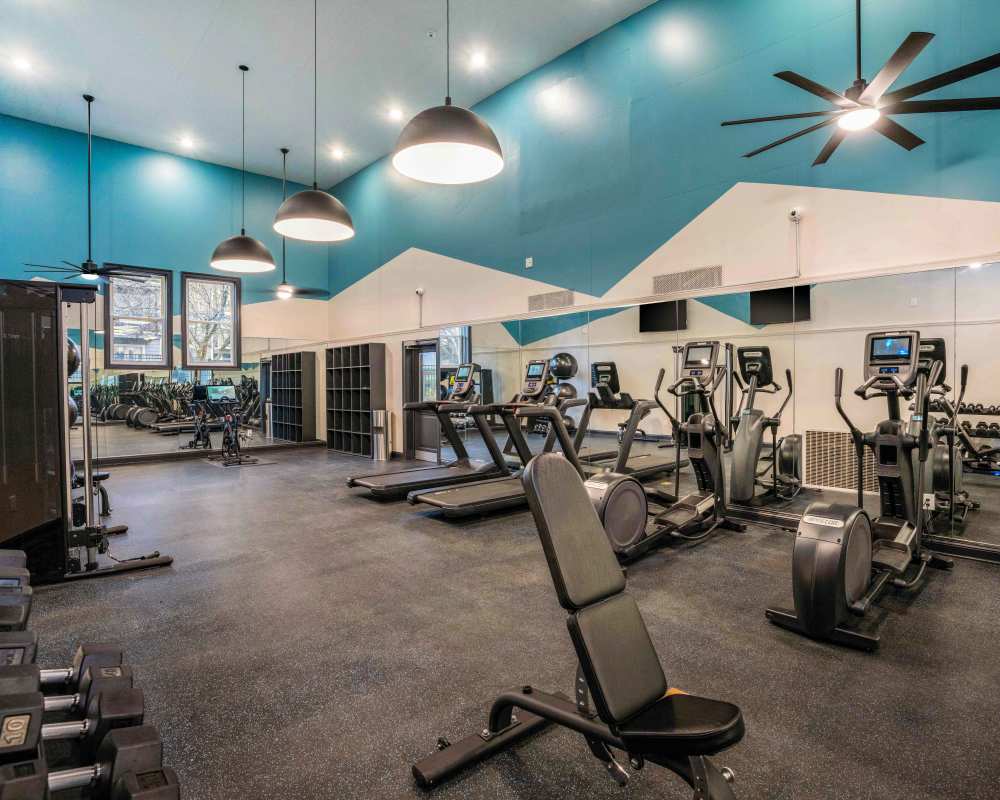 Fitness center with various exercise equipment at Knoll at Fair Oaks in Fairfax, Virginia
