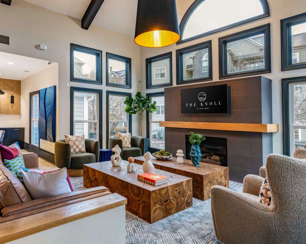 Clubhouse lounge with fireplace at Knoll at Fair Oaks in Fairfax, Virginia