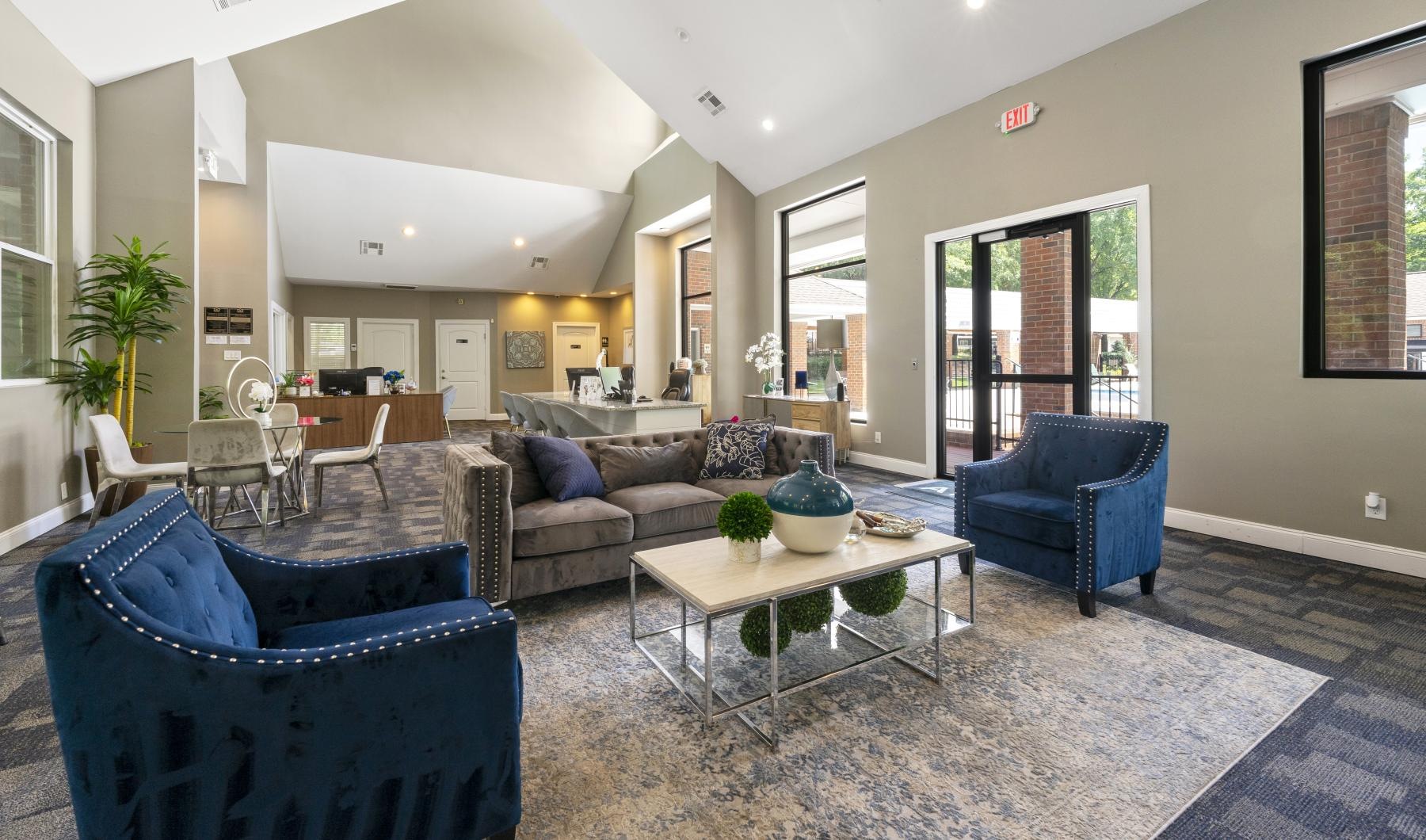 a living room with a couch and chairs