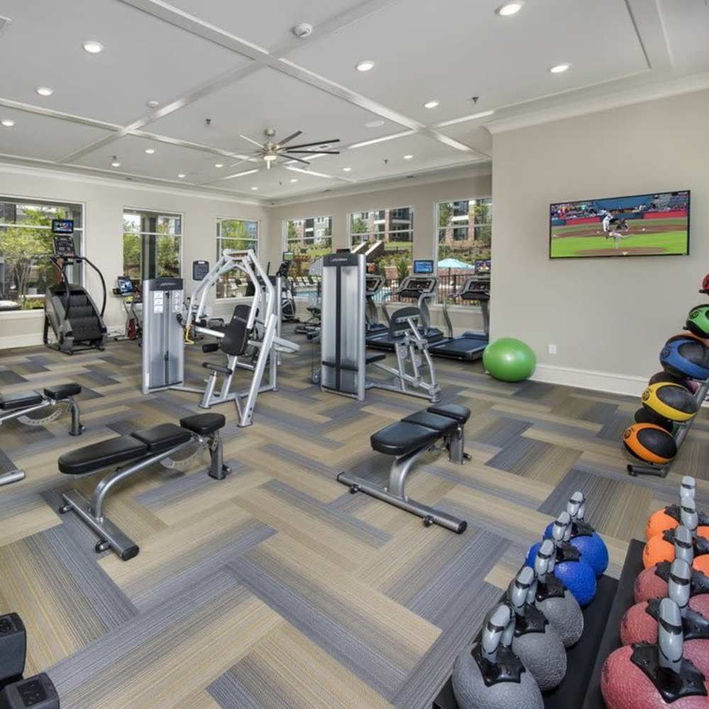 Fitness center with television at The Meridian Lafayette in Fayetteville, Georgia