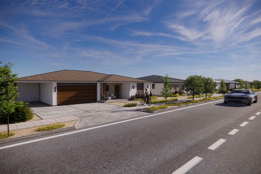 front of a house showing the blue sky and green grass
