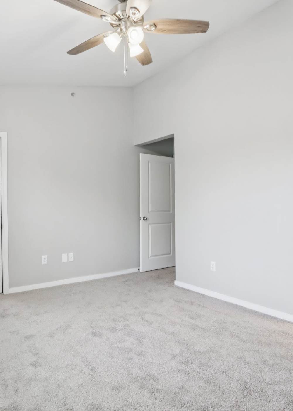 Bedroom with a ceiling fan at City View Farm Apartments in Franklin, Indiana