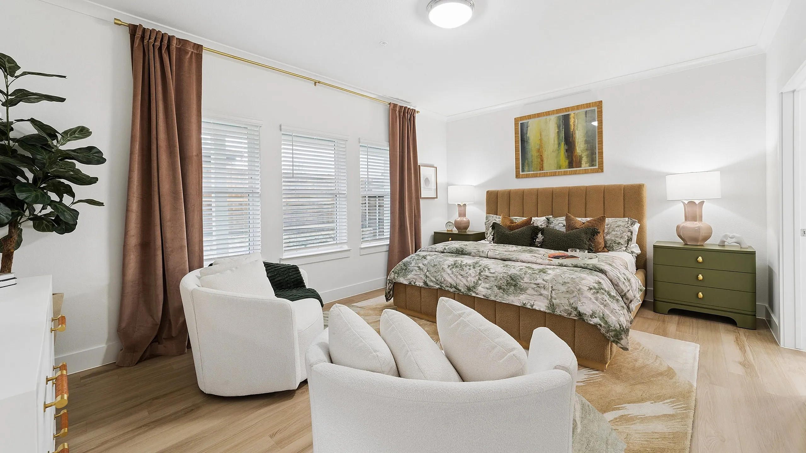 Sophisticated bedroom featuring a cozy bed with plush pillows, elegant green nightstands, and stylish decor under soft lighting.