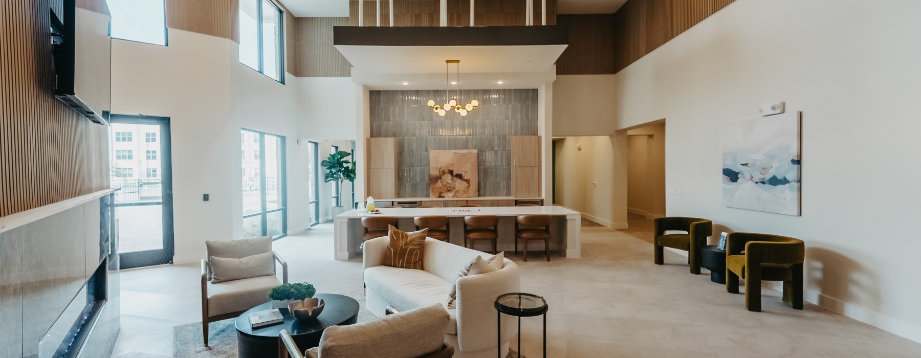 a great room with a chandelier and a couch