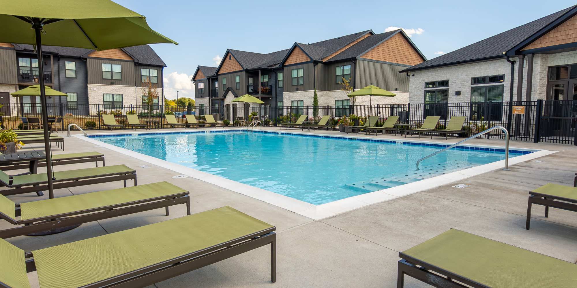 Refreshing pool with sun loungers at Meribel in Springboro, Ohio