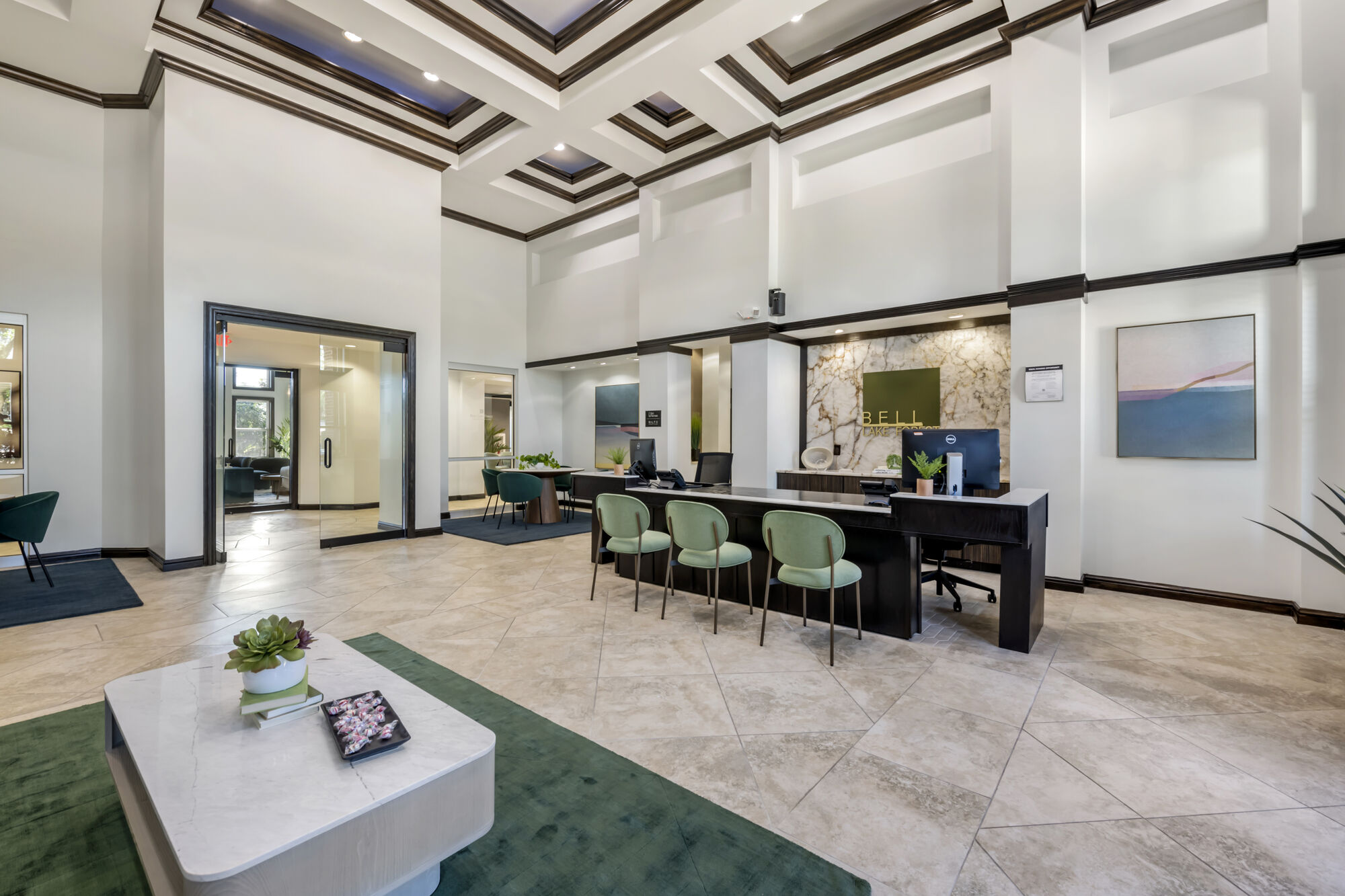 Leasing lobby with reception desk and lounge seating