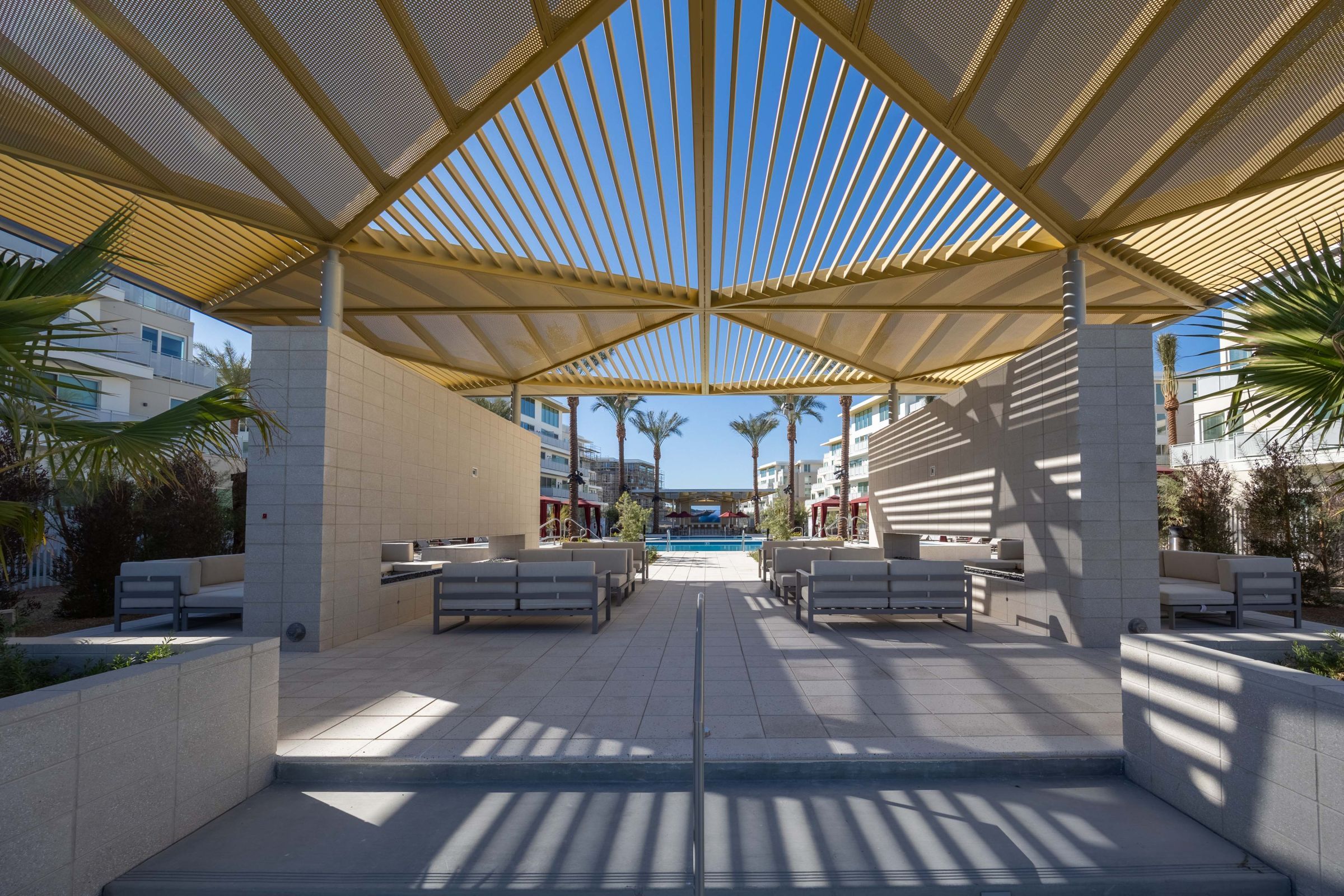 Evora A serene outdoor patio at the resort, featuring comfortable seating and lush greenery, perfect for relaxation and gatherings.