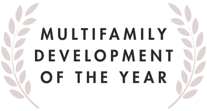 Text reads "Multifamily Development of the Year" with laurel branches on both sides.
