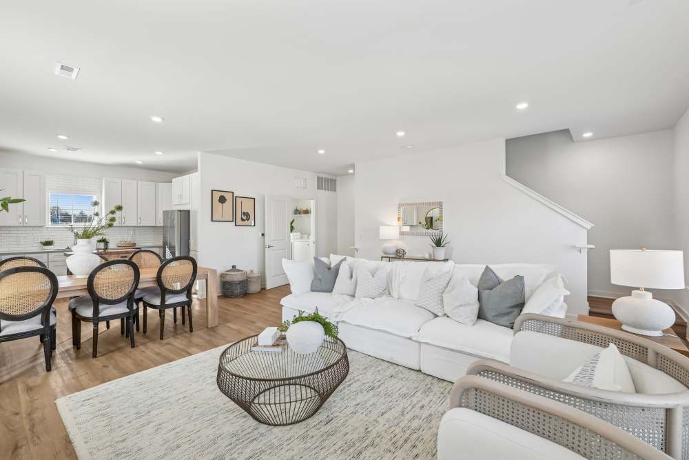 Well-lit living room at Hamlet Quail Crossing in Wake Forest, North Carolina