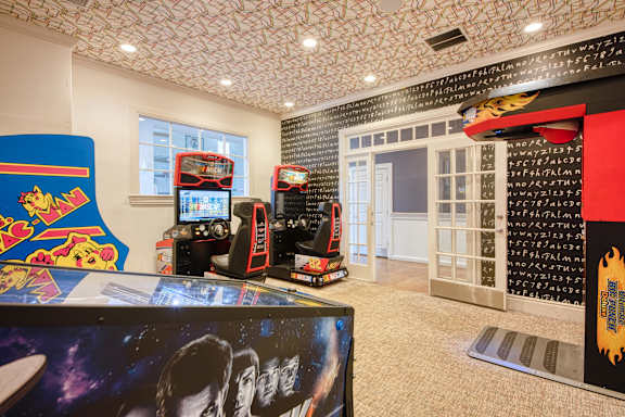 the game room has a lot of video games at Residences at Stevens Pond, Massachusetts, 01906