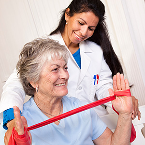 rehab therapist with an elderly woman