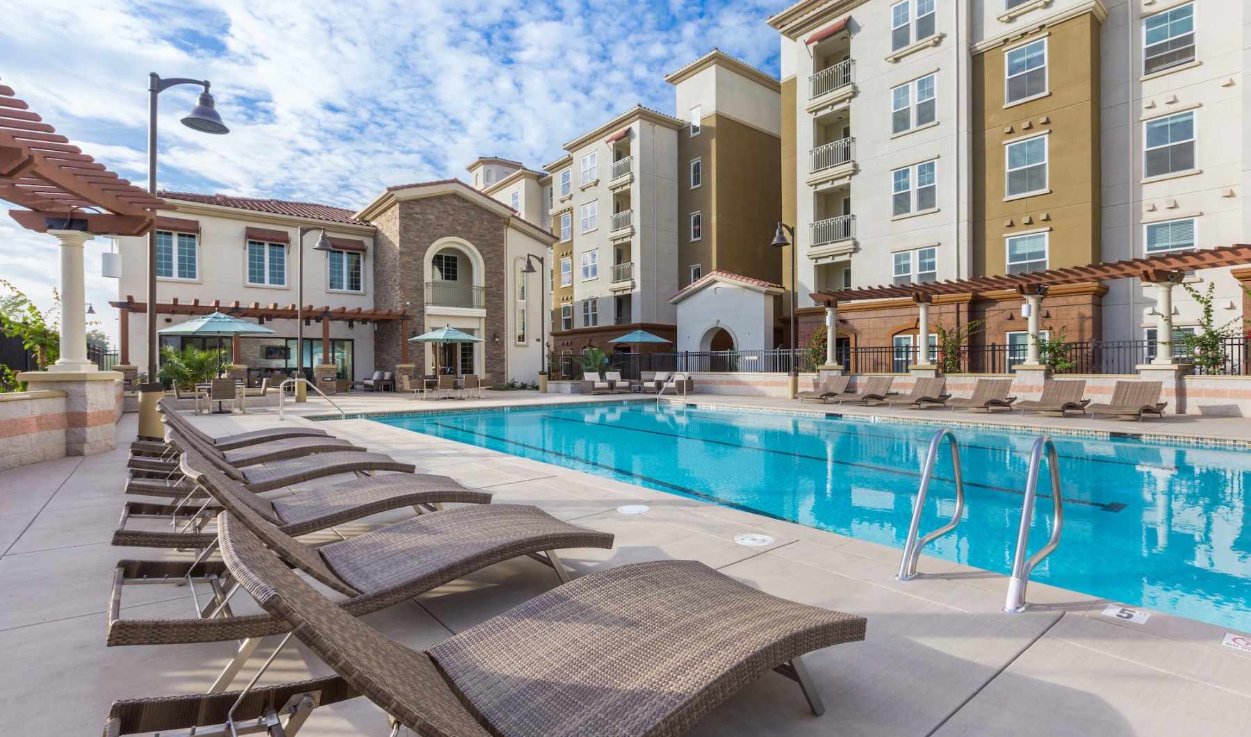 swimming pool with lounge chairs
