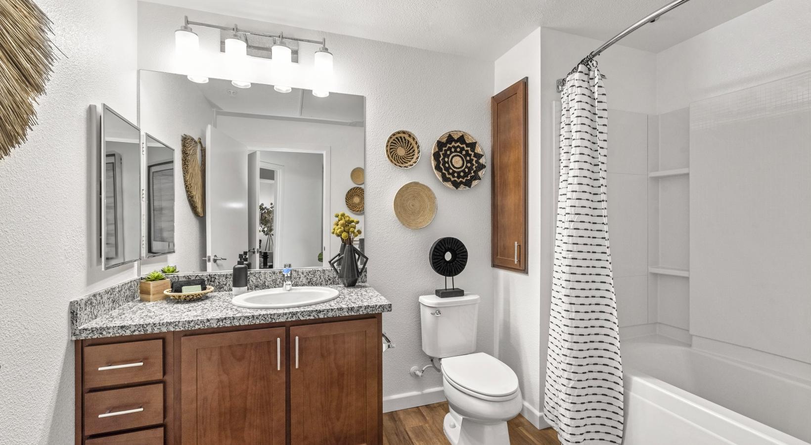 a bathroom with a shower and sink