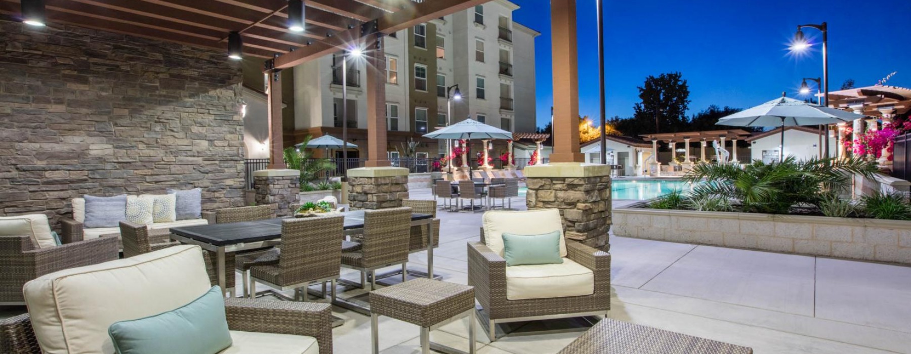 a large patio and chairs and tables