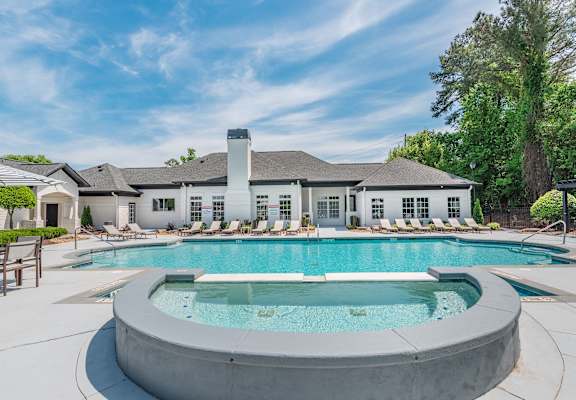 A large house with a pool in the backyard.