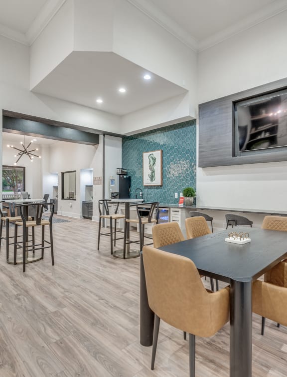 a dining room with a table and chairs