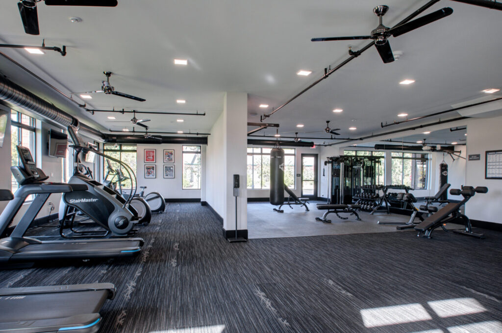 Upscale fitness center at luxury Cherry Hill apartments with cardio equipment and weight machines