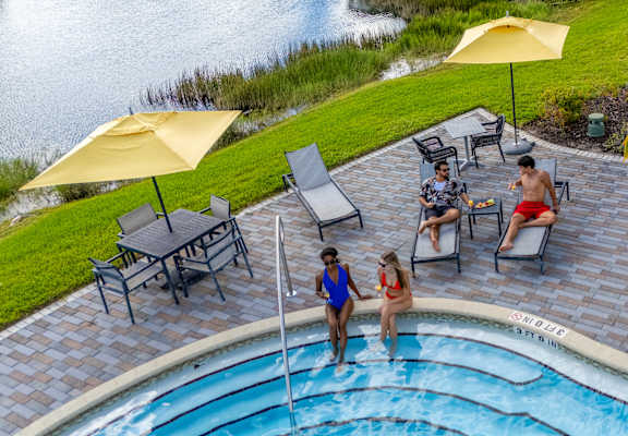 Group of people are enjoying a sunny day by the pool at Portofino Vineyards, Fort Myers, 33967