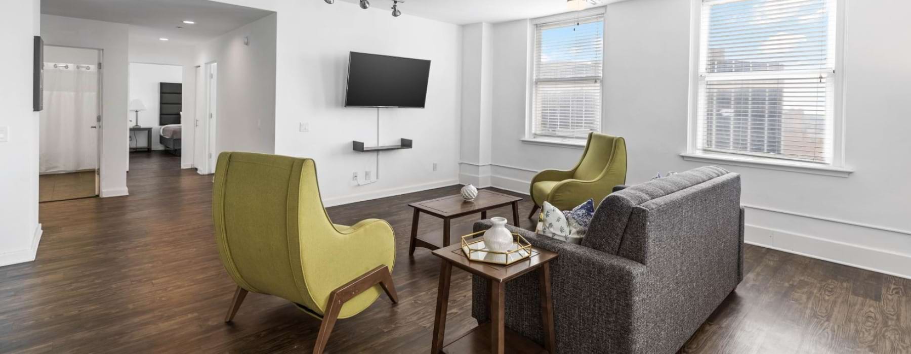 a living room with a tv and couches