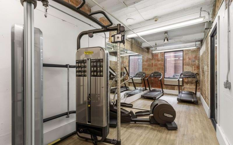a room with a treadmill and treadmills