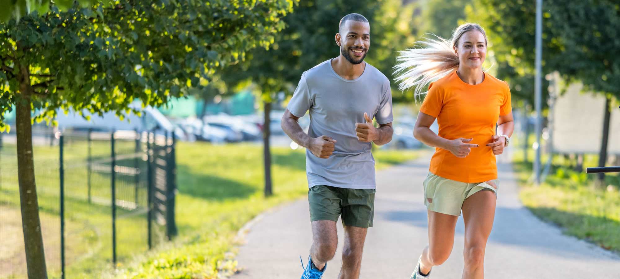 Resident couple jogging at a park near Sherwood Pointe Apartments in Shawnee, Oklahoma