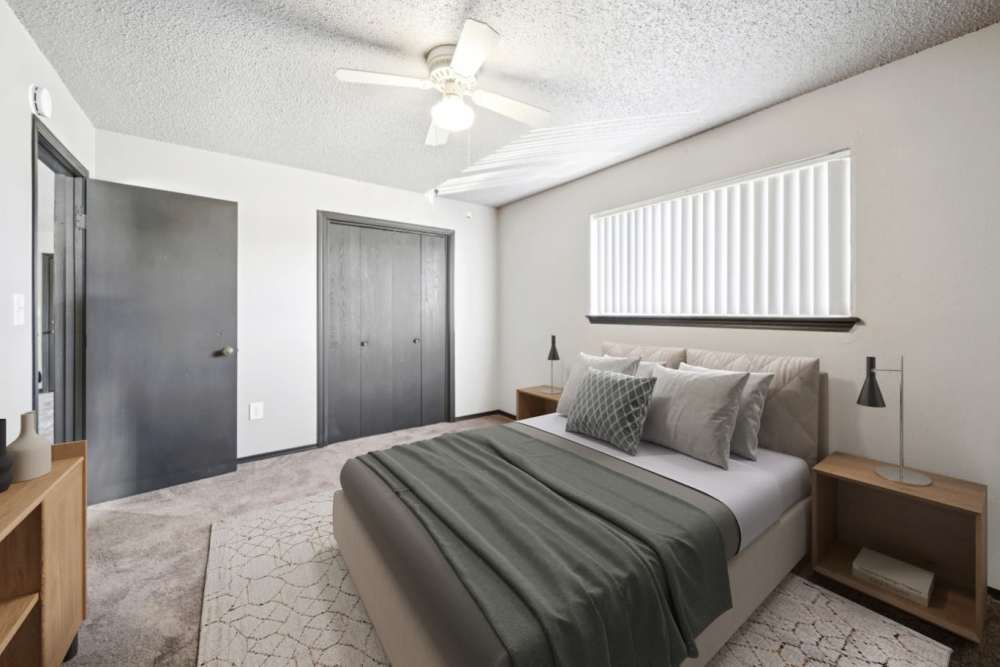 Cozy bedroom with plush carpeting at Sherwood Pointe Apartments in Shawnee, Oklahoma