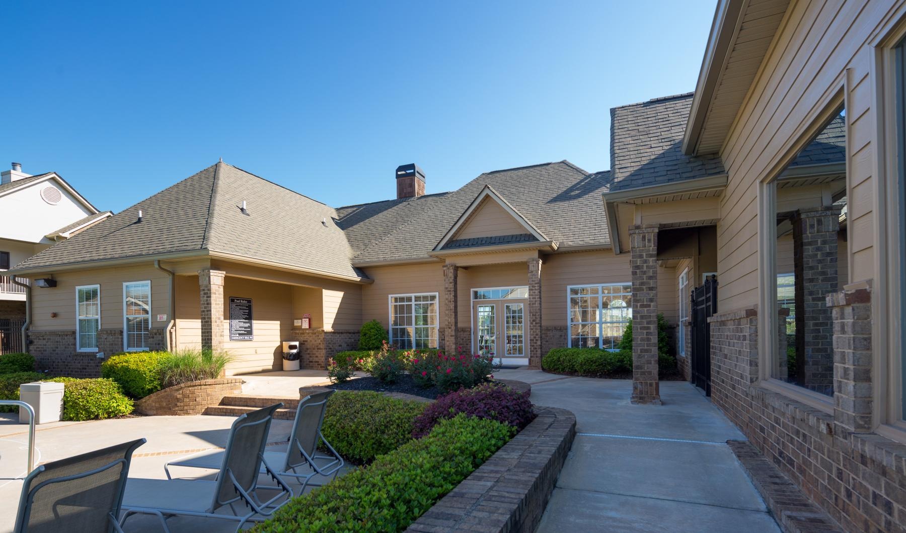 a building with a patio and chairs