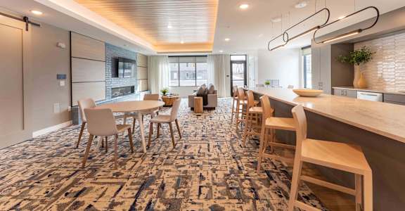 A modern dining area with a long table and chairs.
