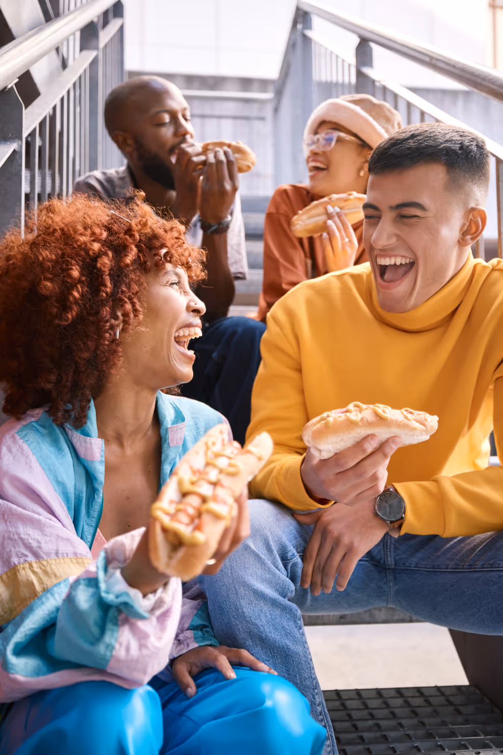 Group of friends laughing with food stock image