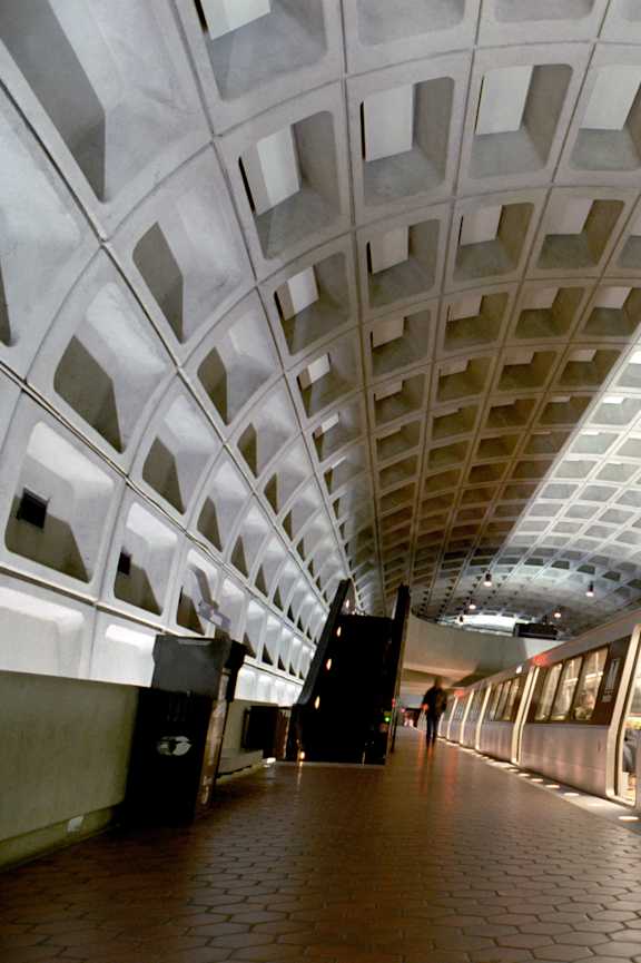 A subway train is on a track in a subway station at Highland Ridge Apartments, Capitol Heights