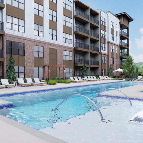 The pool area at Weller at the Preserve senior apartments in Asheville, NC, featuring lounge chairs and umbrellas.