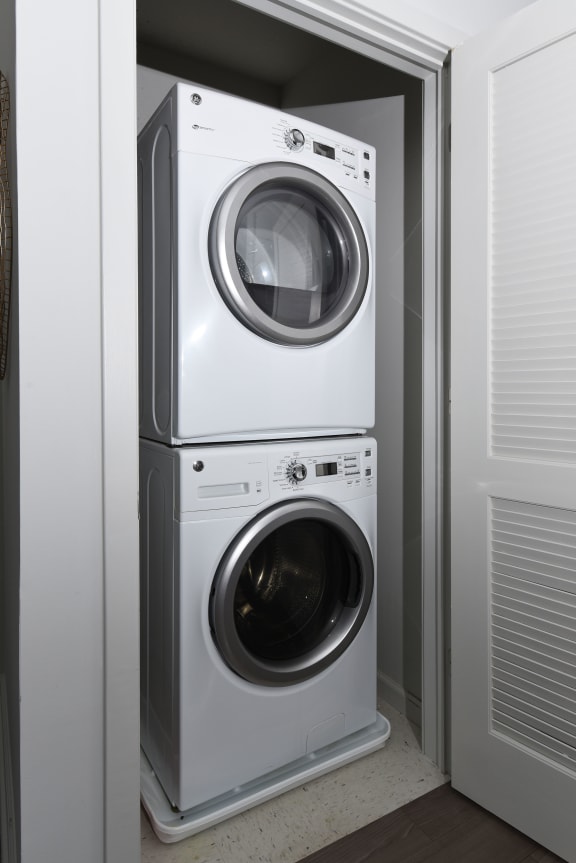 a front load washer and dryer in a laundry room at Heights at Glen Mills, Glen Mills