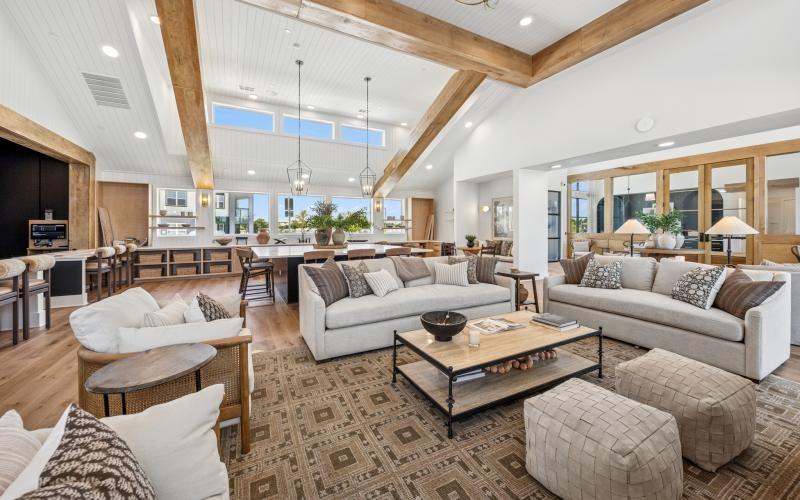 a clubroom with couches, chairs and tables