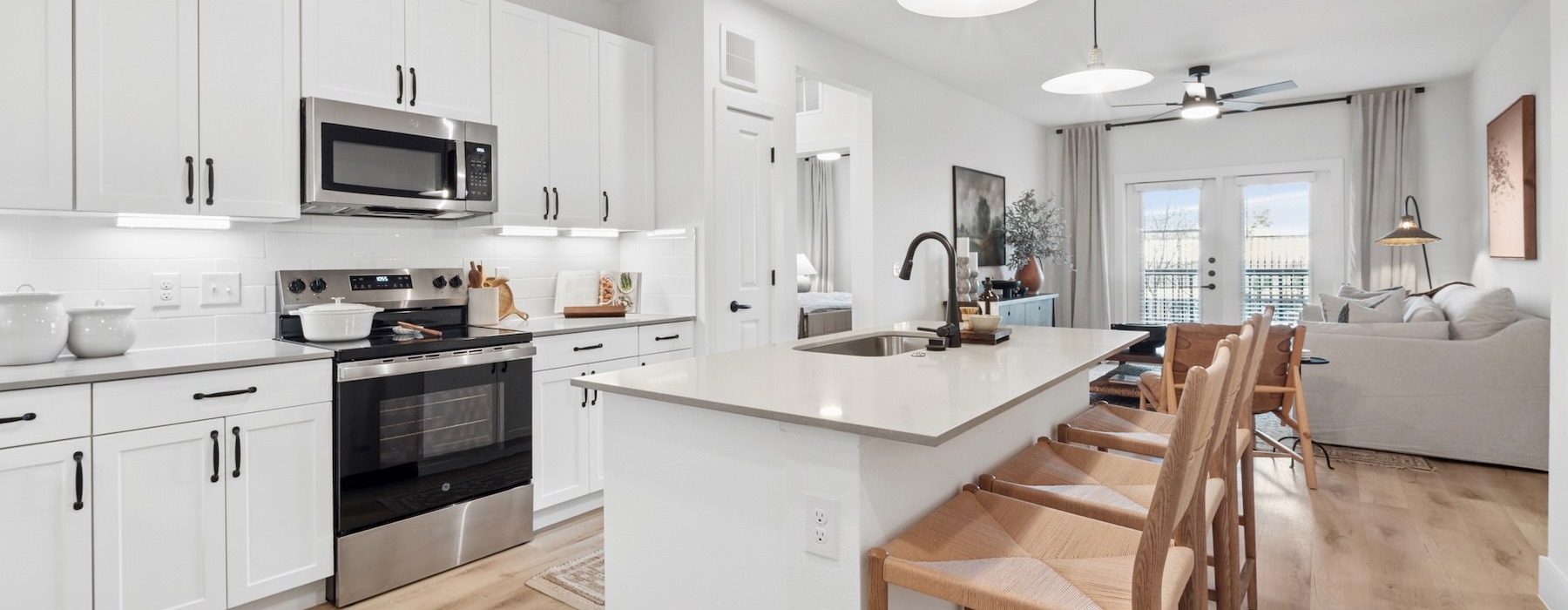 a kitchen with white cabinets